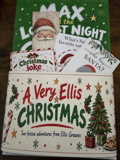 img 7182A Very Ellis Christmas Book Bundle: two Ellis Greaves Christmas books with a bookmark, joke cards and scratch card in a festive belly band